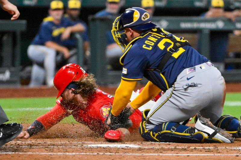 Sep 19, 2025; St. Louis, Missouri, USA;  St. Louis Cardinals second baseman Brendan Donovan (33) is tagged out at home by Milwaukee Brewers catcher William Contreras (24) during the third inning at Busch Stadium. Mandatory Credit: Jeff Curry-Imagn Images