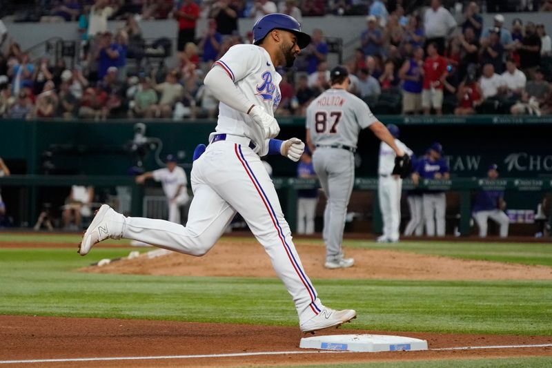 Jun 29, 2023; Arlington, Texas, USA; Texas Rangers shortstop Ezequiel Duran (20) rounds the bases after hitting a solo home run during the fourth inning against the Detroit Tigers at Globe Life Field. Mandatory Credit: Raymond Carlin III-USA TODAY Sports