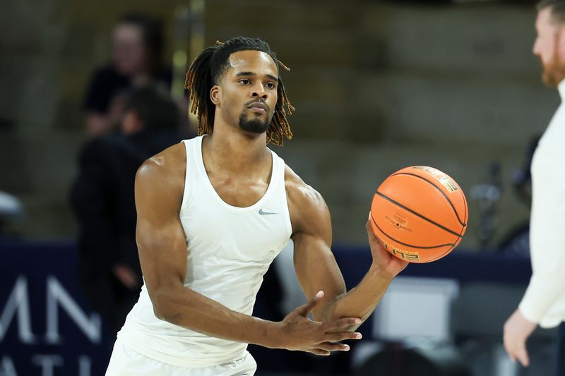 Jan 30, 2024; Logan, Utah, USA; Utah State Aggies guard Josh Uduje (14) warms up before the game against the San Jose State Spartans at Dee Glen Smith Spectrum. Mandatory Credit: Rob Gray-USA TODAY Sports