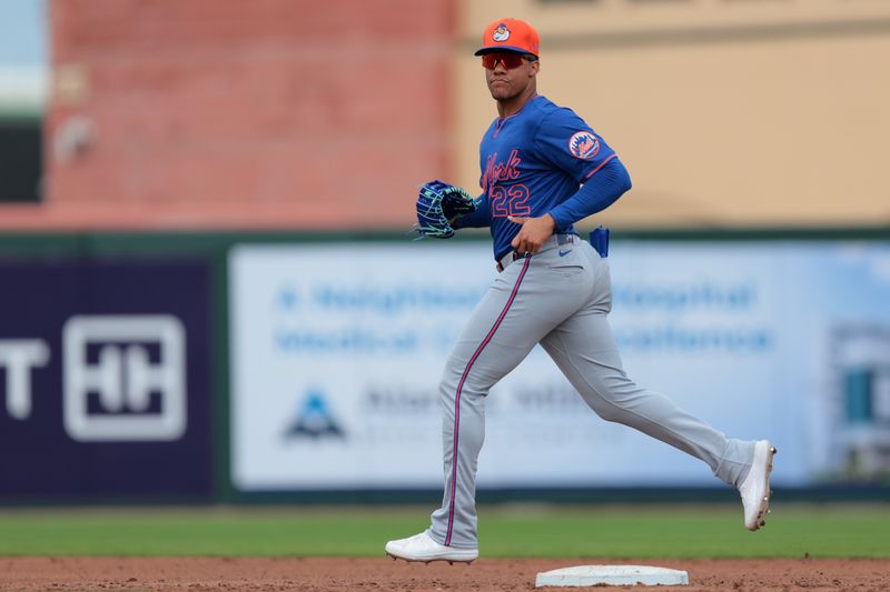 Feb 24, 2025; Jupiter, Florida, USA; New York Mets right fielder Juan Soto (22) returns to the dugout against the St. Louis Cardinals during the third inning at Roger Dean Chevrolet Stadium. Mandatory Credit: Sam Navarro-Imagn Images