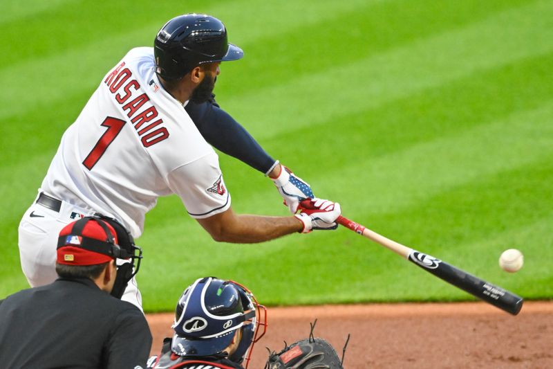 Jul 4, 2023; Cleveland, Ohio, USA; Cleveland Guardians shortstop Amed Rosario (1) hits a solo home run in the sixth inning against the Atlanta Braves at Progressive Field. Mandatory Credit: David Richard-USA TODAY Sports