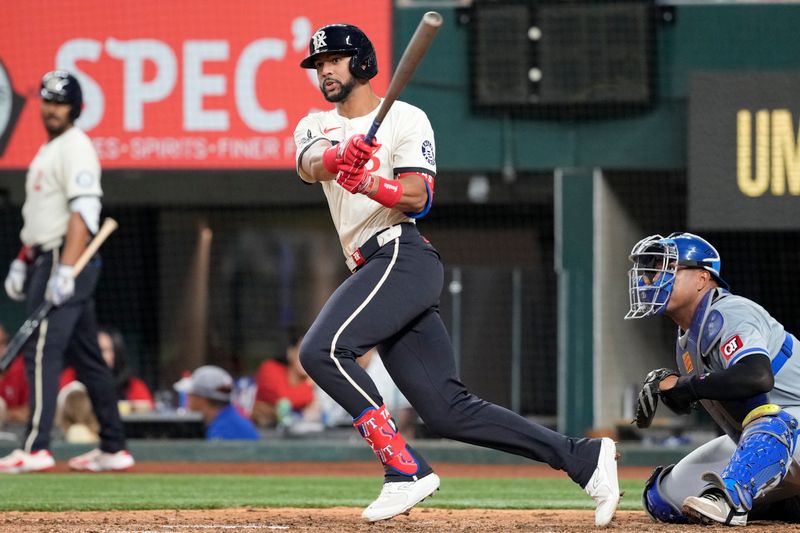 Jun 21, 2024; Arlington, Texas, USA; Texas Rangers center fielder Leody Taveras (3) follows through on his RBI single against the Kansas City Royals during the sixth inning at Globe Life Field. Mandatory Credit: Jim Cowsert-USA TODAY Sports