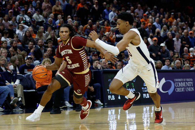 Jan 28, 2023; Charlottesville, Virginia, USA; Boston College Eagles guard DeMarr Langford Jr. (5) drives to the basket as Virginia Cavaliers guard Ryan Dunn (13) defends in the first half at John Paul Jones Arena. Mandatory Credit: Geoff Burke-USA TODAY Sports