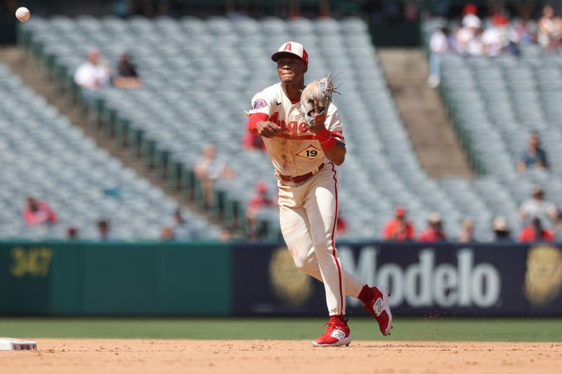 Sep 10, 2023; Anaheim, California, USA; Los Angeles Angels second baseman Kyren Paris (19) throws the ball to first base against the Cleveland Guardians during the fourth inning at Angel Stadium. Mandatory Credit: Jessica Alcheh-USA TODAY Sports