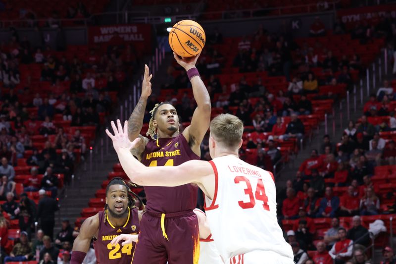 Feb 10, 2024; Salt Lake City, Utah, USA; Arizona State Sun Devils guard Adam Miller (44) shoots over Utah Utes center Lawson Lovering (34) during the first half at Jon M. Huntsman Center. Mandatory Credit: Rob Gray-USA TODAY Sports