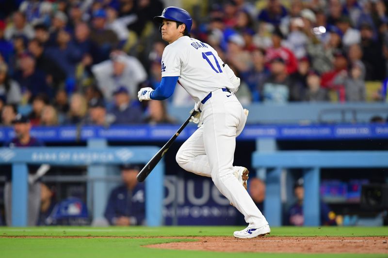 May 4, 2024; Los Angeles, California, USA; Los Angeles Dodgers designated hitter Shohei Ohtani (17) runs out a fly ball against the Atlanta Braves during the sixth inning at Dodger Stadium. Mandatory Credit: Gary A. Vasquez-USA TODAY Sports