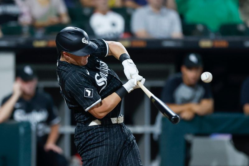 Aug 26, 2024; Chicago, Illinois, USA; Chicago White Sox first baseman Andrew Vaughn (25) hits an RBI-single against the Detroit Tigers during the third inning at Guaranteed Rate Field. Mandatory Credit: Kamil Krzaczynski-USA TODAY Sports