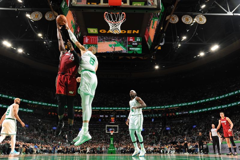 BOSTON, MA - APRIL 21: Kristaps Porzingis #8 of the Boston Celtics blocks a shot during the game against the Miami Heat during Round 1 Game 1 of the 2024 NBA Playoffs on April 21, 2024 at the TD Garden in Boston, Massachusetts. NOTE TO USER: User expressly acknowledges and agrees that, by downloading and or using this photograph, User is consenting to the terms and conditions of the Getty Images License Agreement. Mandatory Copyright Notice: Copyright 2024 NBAE  (Photo by Brian Babineau/NBAE via Getty Images)