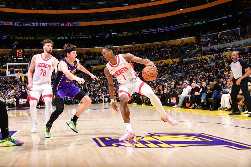 LOS ANGELES, CA - MARCH 31: Amen Thompson #1 of the Houston Rockets handles the ball during the game against the Los Angeles Lakers on March 31, 2025 at Crypto.Com Arena in Los Angeles, California. NOTE TO USER: User expressly acknowledges and agrees that, by downloading and/or using this Photograph, user is consenting to the terms and conditions of the Getty Images License Agreement. Mandatory Copyright Notice: Copyright 2025 NBAE (Photo by Adam Pantozzi/NBAE via Getty Images)