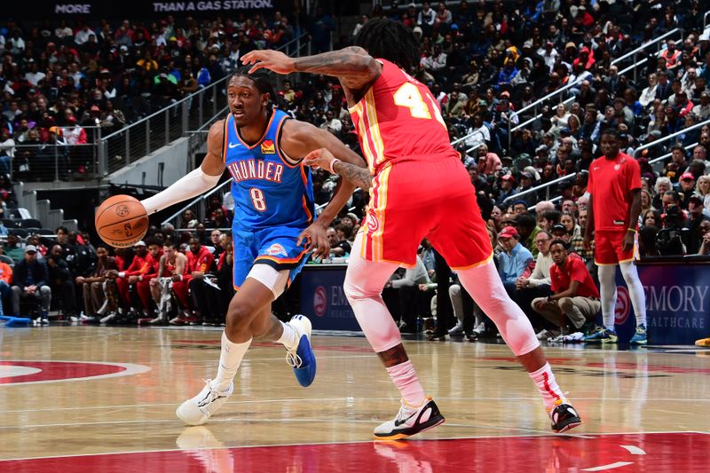 ATLANTA, GA - JANUARY 3: Jalen Williams #8 of the Oklahoma City Thunder handles the ball during the game against the Atlanta Hawks on January 3, 2024 at State Farm Arena in Atlanta, Georgia.  NOTE TO USER: User expressly acknowledges and agrees that, by downloading and/or using this Photograph, user is consenting to the terms and conditions of the Getty Images License Agreement. Mandatory Copyright Notice: Copyright 2024 NBAE (Photo by Scott Cunningham/NBAE via Getty Images)