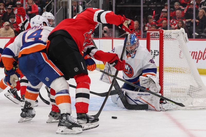 Nov 10, 2025; Newark, New Jersey, USA; New York Islanders goaltender Ilya Sorokin (30) defends his net against the New Jersey Devils during the second period at Prudential Center. Mandatory Credit: Ed Mulholland-Imagn Images