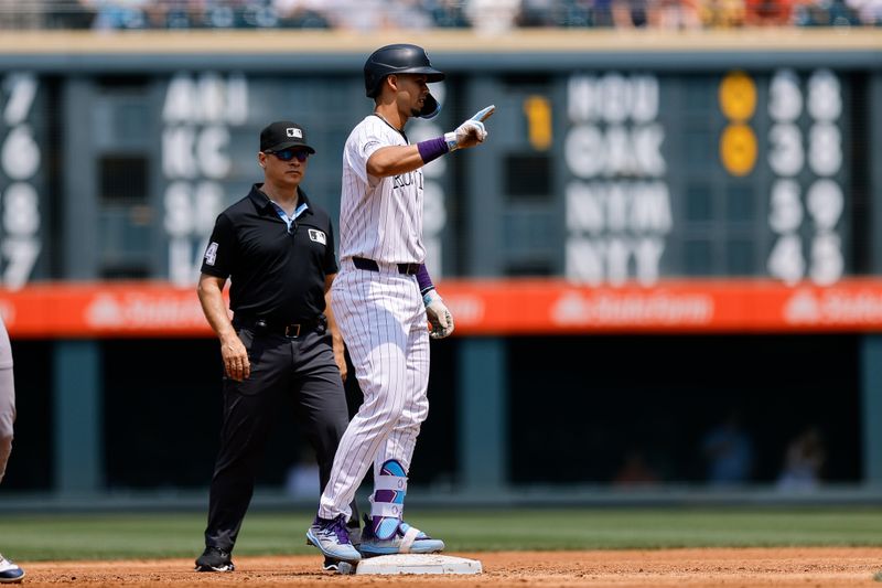 Jul 24, 2024; Denver, Colorado, USA; Colorado Rockies shortstop Ezequiel Tovar (14) reacts from second on an RBI double in the second inning against the Boston Red Sox at Coors Field. Mandatory Credit: Isaiah J. Downing-USA TODAY Sports