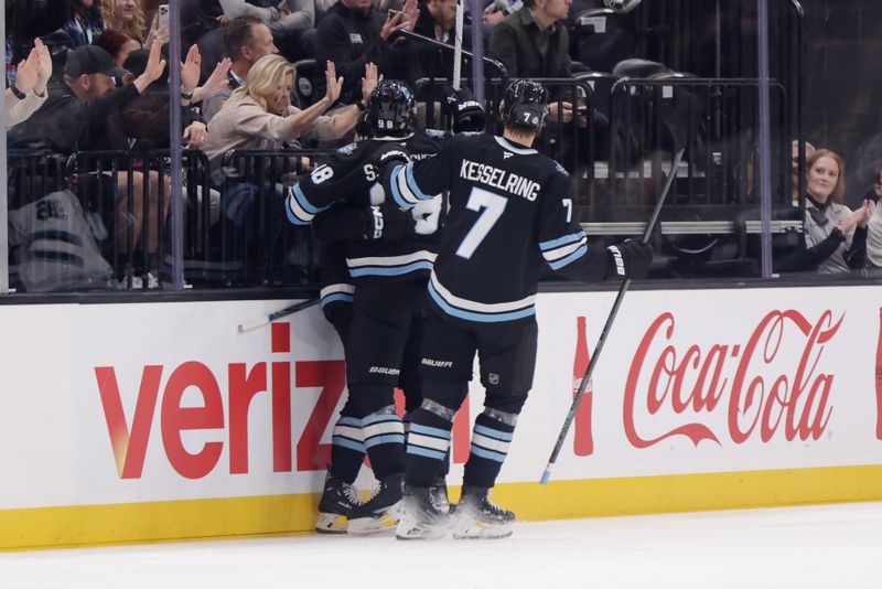 Oct 28, 2024; Salt Lake City, Utah, USA; Utah Hockey Club celebrate a goal by right wing Dylan Guenther (11) during the first period against the San Jose Sharks at Delta Center. Mandatory Credit: Chris Nicoll-Imagn Images