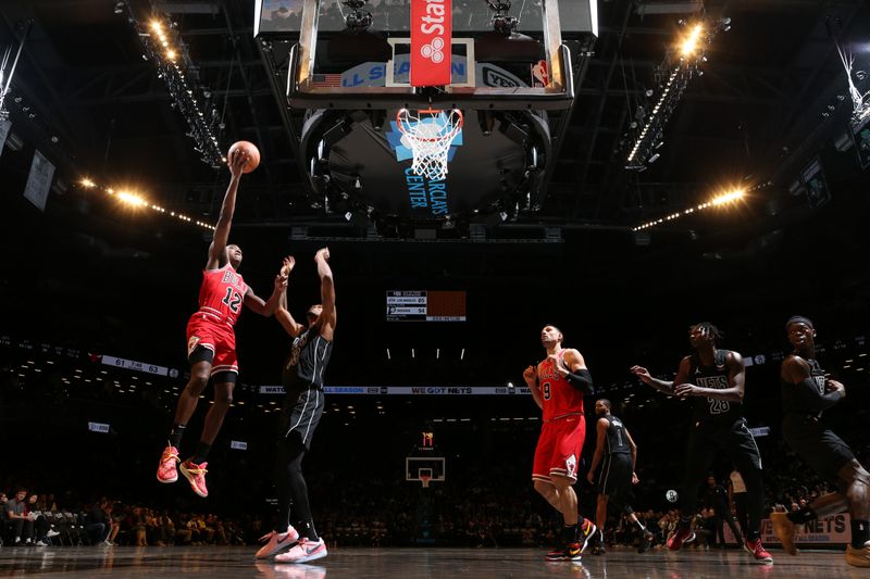 BROOKLYN, NY - MARCH 29: Ayo Dosunmu #12 of the Chicago Bulls drives to the basket during the game against the Brooklyn Nets on March 29, 2024 at Barclays Center in Brooklyn, New York. NOTE TO USER: User expressly acknowledges and agrees that, by downloading and or using this Photograph, user is consenting to the terms and conditions of the Getty Images License Agreement. Mandatory Copyright Notice: Copyright 2024 NBAE (Photo by Nathaniel S. Butler/NBAE via Getty Images)