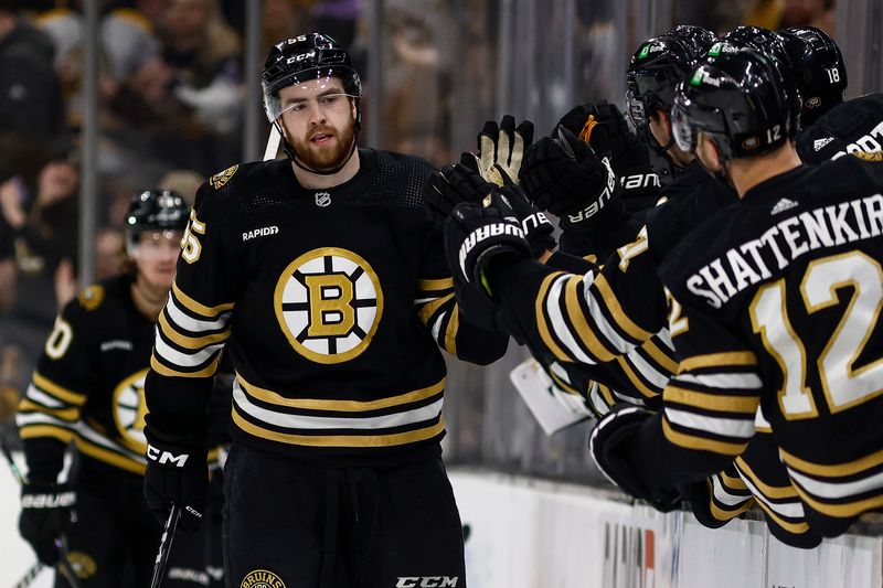 Feb 19, 2024; Boston, Massachusetts, USA; Boston Bruins right wing Justin Brazeau (55) is congratulated at the bench after scoring his first NHL goal during the second period against the Dallas Stars at TD Garden. Mandatory Credit: Winslow Townson-USA TODAY Sports