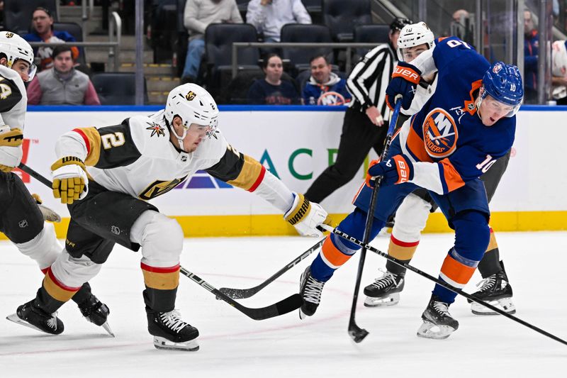 Jan 23, 2024; Elmont, New York, USA;  New York Islanders right wing Simon Holmstrom (10) attempts a shot defended by Vegas Golden Knights defenseman Zach Whitecloud (2) during the second period at UBS Arena. Mandatory Credit: Dennis Schneidler-USA TODAY Sports