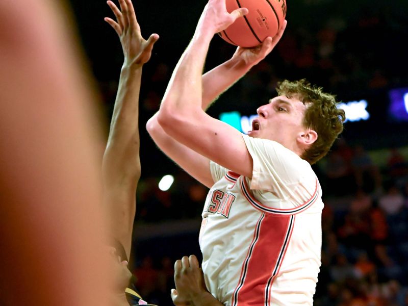 Feb 26, 2025; Clemson, South Carolina, USA; Clemson sophomore center Viktor Lakhin (0) shoots the ball against Notre Dame during the second half at Littlejohn Coliseum. Mandatory Credit: Ken Ruinard-Imagn Images