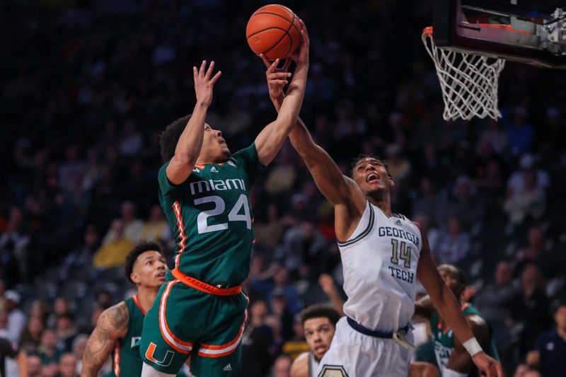 Jan 4, 2023; Atlanta, Georgia, USA; Miami Hurricanes guard Nijel Pack (24) grabs a rebound past Georgia Tech Yellow Jackets forward Jalon Moore (14) in the second half at McCamish Pavilion. Mandatory Credit: Brett Davis-USA TODAY Sports