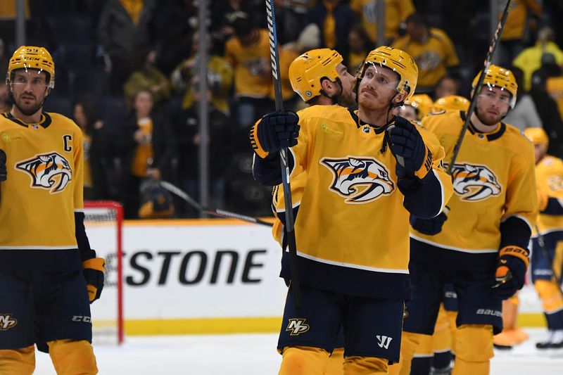 Nov 26, 2023; Nashville, Tennessee, USA; Nashville Predators left wing Gustav Nyquist (14) celebrates with teammates after a win against the Winnipeg Jets at Bridgestone Arena. Mandatory Credit: Christopher Hanewinckel-USA TODAY Sports