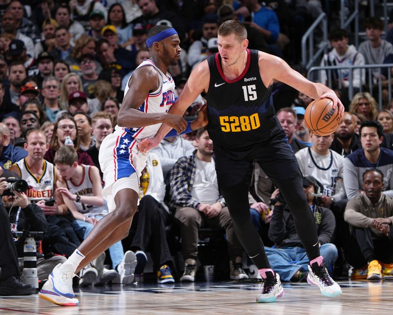 DENVER, CO - JANUARY 27: Nikola Jokic #15 of the Denver Nuggets dribbles the ball during the game against the Philadelphia 76ers on January 27, 2024 at the Ball Arena in Denver, Colorado. NOTE TO USER: User expressly acknowledges and agrees that, by downloading and/or using this Photograph, user is consenting to the terms and conditions of the Getty Images License Agreement. Mandatory Copyright Notice: Copyright 2024 NBAE (Photo by Garrett Ellwood/NBAE via Getty Images)