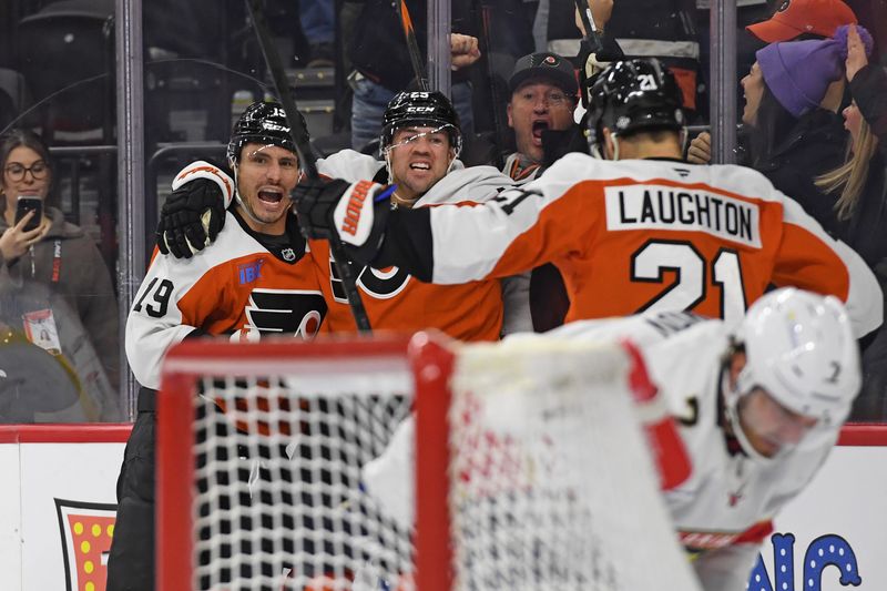 Dec 5, 2024; Philadelphia, Pennsylvania, USA; Philadelphia Flyers right wing Garnet Hathaway (19) celebrates his goal with center Ryan Poehling (25) and center Scott Laughton (21) against the Florida Panthers during the third period at Wells Fargo Center. Mandatory Credit: Eric Hartline-Imagn Images