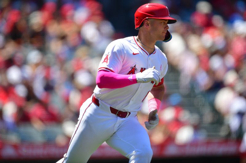 May 12, 2024; Anaheim, California, USA; Los Angeles Angels catcher Logan O'Hoppe (14) runs after hitting a single against the Kansas City Royals during the fourth inning at Angel Stadium. Mandatory Credit: Gary A. Vasquez-USA TODAY Sports