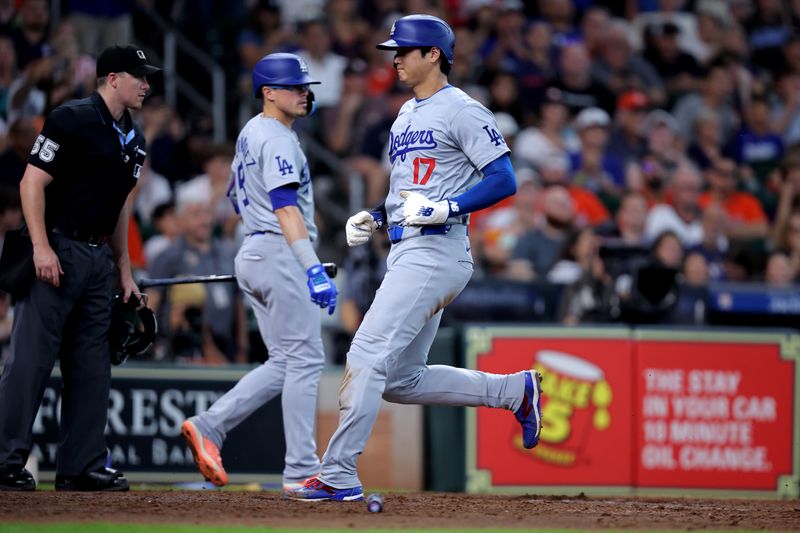 Jul 28, 2024; Houston, Texas, USA; Los Angeles Dodgers designated hitter Shohei Ohtani (17) crosses home plate to score a run against the Houston Astros at Minute Maid Park. Mandatory Credit: Erik Williams-USA TODAY Sports