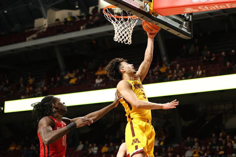 Mar 2, 2023; Minneapolis, Minnesota, USA; Minnesota Golden Gophers forward Dawson Garcia (3) shoots while Rutgers Scarlet Knights center Clifford Omoruyi (11) defends during the first half at Williams Arena. Mandatory Credit: Matt Krohn-USA TODAY Sports