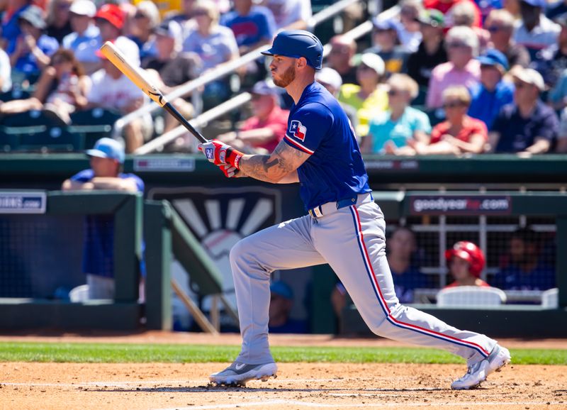 Mar 20, 2024; Goodyear, Arizona, USA; Texas Rangers designated hitter Jonah Heim against the Cincinnati Reds during a spring training baseball game at Goodyear Ballpark. Mandatory Credit: Mark J. Rebilas-USA TODAY Sports