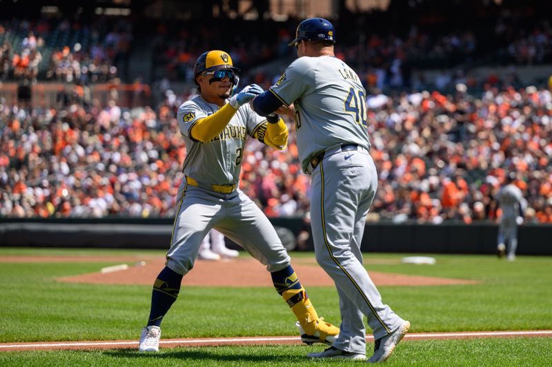 Apr 14, 2024; Baltimore, Maryland, USA; Milwaukee Brewers catcher William Contreras (24) celebrates with third base coach Jason Lane (40) after a home run during the first inning against the Baltimore Orioles at Oriole Park at Camden Yards. Mandatory Credit: Reggie Hildred-USA TODAY Sports