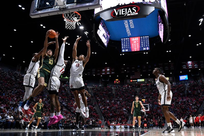 Feb 13, 2024; San Diego, California, USA; Colorado State Rams guard Nique Clifford (10) goes to the basket past San Diego State Aztecs guard Reese Waters (14) during the second half at Viejas Arena. Mandatory Credit: Orlando Ramirez-USA TODAY Sports