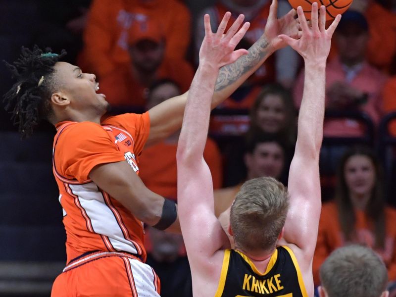 Feb 24, 2024; Champaign, Illinois, USA;  Illinois Fighting Illini guard Terrence Shannon Jr. (0) shoots the ball over Iowa Hawkeyes forward Ben Krikke (23) during the second half at State Farm Center. Mandatory Credit: Ron Johnson-USA TODAY Sports