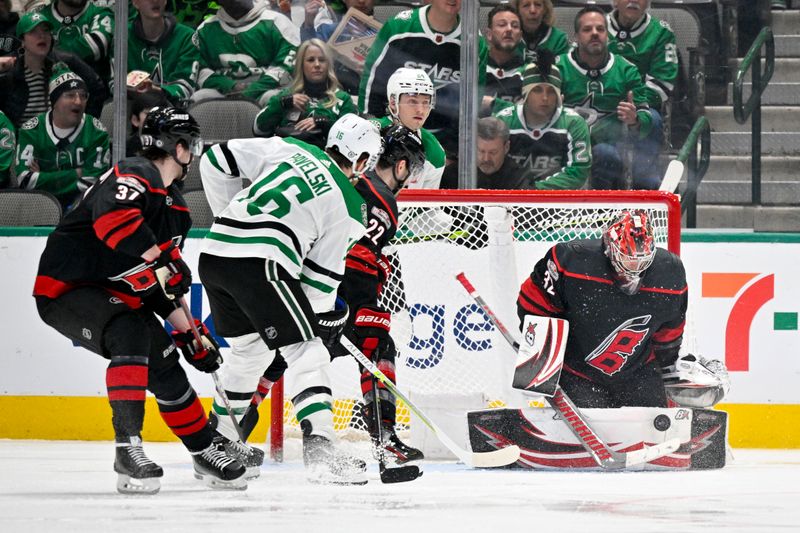 Jan 25, 2023; Dallas, Texas, USA; Carolina Hurricanes goaltender Antti Raanta (32) stops a shot as defenseman Brett Pesce (22) and Dallas Stars center Joe Pavelski (16) look for the rebound during the third period at the American Airlines Center. Mandatory Credit: Jerome Miron-USA TODAY Sports