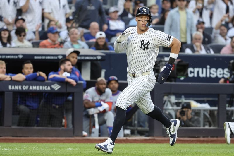May 18, 2025; Bronx, New York, USA;  New York Yankees right fielder Aaron Judge (99) runs to home plate in the first inning against the New York Mets at Yankee Stadium. Mandatory Credit: Wendell Cruz-Imagn Images