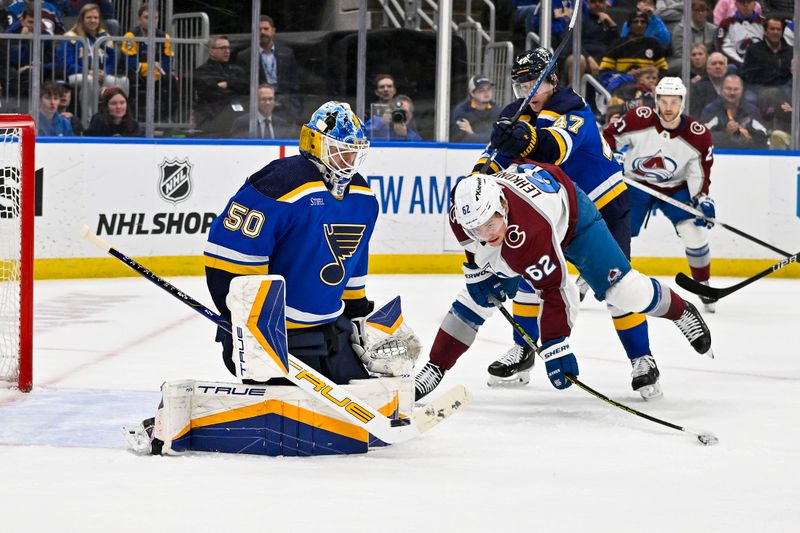 Mar 19, 2024; St. Louis, Missouri, USA;  St. Louis Blues goaltender Jordan Binnington (50) and defenseman Torey Krug (47) defend the net against Colorado Avalanche left wing Artturi Lehkonen (62) during the first period at Enterprise Center. Mandatory Credit: Jeff Curry-USA TODAY Sports