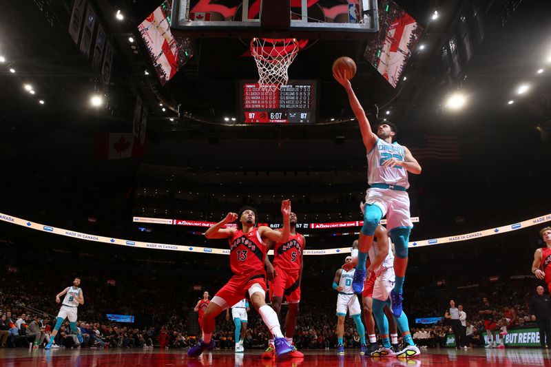 TORONTO, CANADA - MARCH 3: Vasilije Micic #22 of the Charlotte Hornets drives to the basket during the game against the Toronto Raptors on March 3, 2024 at the Scotiabank Arena in Toronto, Ontario, Canada.  NOTE TO USER: User expressly acknowledges and agrees that, by downloading and or using this Photograph, user is consenting to the terms and conditions of the Getty Images License Agreement.  Mandatory Copyright Notice: Copyright 2024 NBAE (Photo by Vaughn Ridley/NBAE via Getty Images)