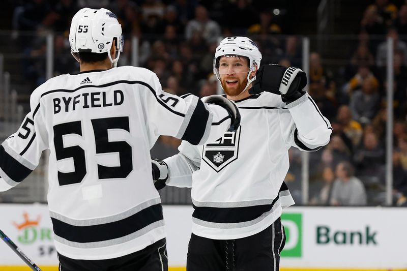 Feb 17, 2024; Boston, Massachusetts, USA; Los Angeles Kings defenseman Vladislav Gavrikov (84) celebrates his goal against the Boston Bruins with right wing Quinton Byfield (55) during the second period at TD Garden. Mandatory Credit: Winslow Townson-USA TODAY Sports