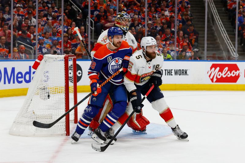 Jun 15, 2024; Edmonton, Alberta, CAN;Edmonton Oilers left wing Zach Hyman (18) skates against Florida Panthers defenseman Aaron Ekblad (5) in the second period in game four of the 2024 Stanley Cup Final at Rogers Place. Mandatory Credit: Perry Nelson-USA TODAY Sports