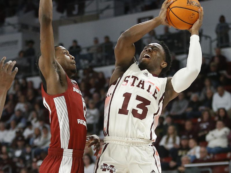 Feb 17, 2024; Starkville, Mississippi, USA; Mississippi State Bulldogs guard Josh Hubbard (13) shoots the ball against Arkansas Razorbacks guard Tramon Mark (12) during the first half at Humphrey Coliseum. Mandatory Credit: Petre Thomas-USA TODAY Sports