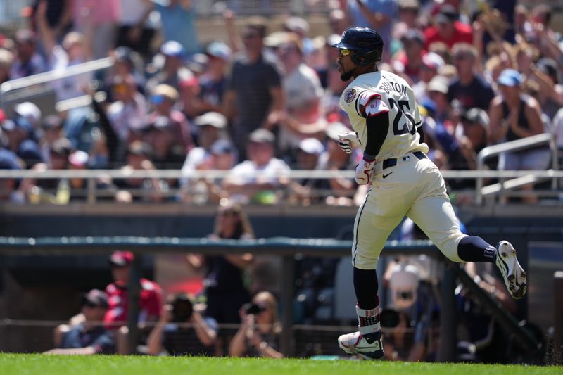 Aug 11, 2024; Minneapolis, Minnesota, USA; Minnesota Twins center fielder Byron Buxton (25) hits a solo home run during the second inning against the Cleveland Guardians at Target Field. Mandatory Credit: Jordan Johnson-USA TODAY Sports