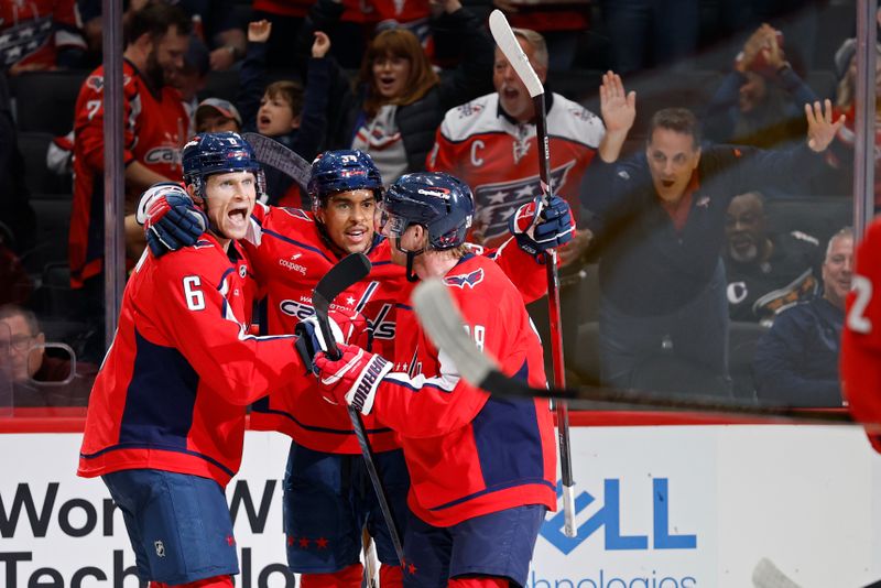 Oct 19, 2025; Washington, District of Columbia, USA; Washington Capitals defenseman Jakob Chychrun (6) celebrates with teammates after scoring a goal against the Vancouver Canucks during the third period at Capital One Arena. Mandatory Credit: Geoff Burke-Imagn Images