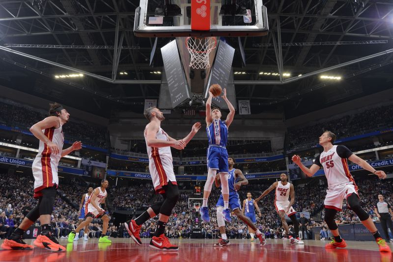 SACRAMENTO, CA - FEBRUARY 26: Kevin Huerter #9 of the Sacramento Kings drives to the basket during the game against the Miami Heat on February 26, 2024 at Golden 1 Center in Sacramento, California. NOTE TO USER: User expressly acknowledges and agrees that, by downloading and or using this Photograph, user is consenting to the terms and conditions of the Getty Images License Agreement. Mandatory Copyright Notice: Copyright 2024 NBAE (Photo by Rocky Widner/NBAE via Getty Images)