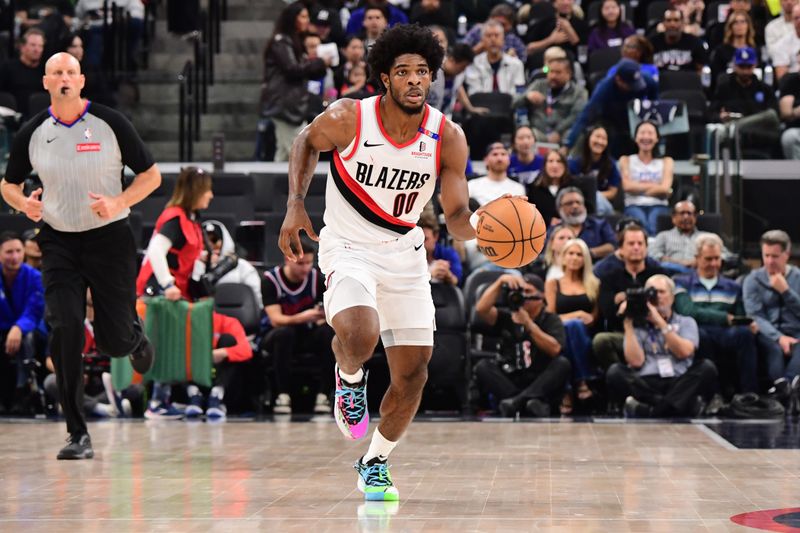 INGLEWOOD, CA - OCTOBER 30: Scoot Henderson #00 of the Portland Trail Blazers dribbles the ball during the game against the LA Clippers on October 30, 2024 at Intuit Dome in Los Angeles, California. NOTE TO USER: User expressly acknowledges and agrees that, by downloading and/or using this Photograph, user is consenting to the terms and conditions of the Getty Images License Agreement. Mandatory Copyright Notice: Copyright 2024 NBAE (Photo by Adam Pantozzi/NBAE via Getty Images)