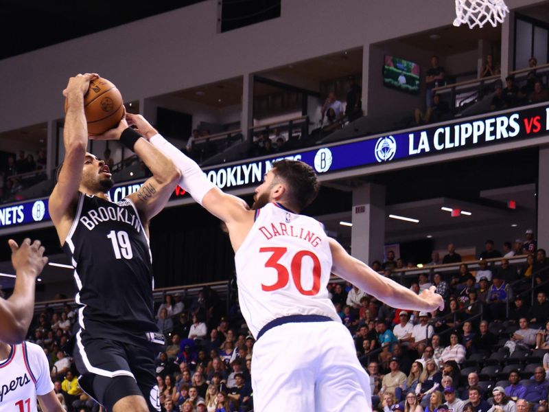 OCEANSIDE, CALIFORNIA - OCTOBER 08: Amari Bailey #10 of the Brooklyn Nets goes up for a shot against Nate Darling #30 of the Los Angeles Clippers in the fourth quarter of the preseason game at Frontwave Arena on October 08, 2024 in Oceanside, California. NOTE TO USER: User expressly acknowledges and agrees that, by downloading and or using this photograph, User is consenting to the terms and conditions of the Getty Images License Agreement. (Photo by Joe Scarnici/Getty Images)