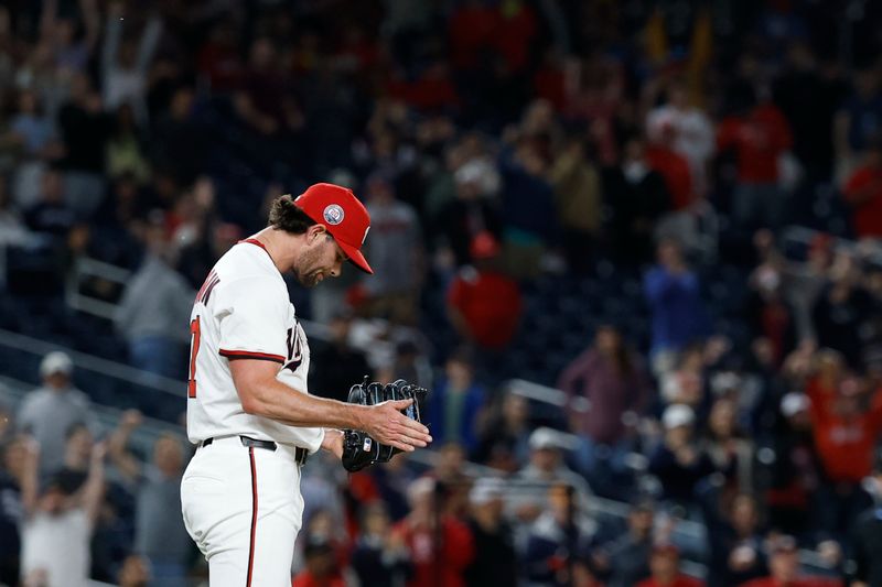 May 20, 2025; Washington, District of Columbia, USA; Washington Nationals pitcher Kyle Finnegan (67) reacts after the final out against the Atlanta Braves at Nationals Park. Mandatory Credit: Geoff Burke-Imagn Images