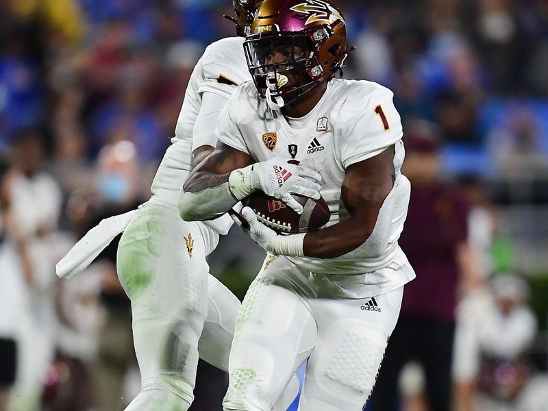 Oct 2, 2021; Pasadena, California, USA; Arizona State Sun Devils running back DeaMonte Trayanum (1) runs the ball against the UCLA Bruins during the first half at Rose Bowl. Mandatory Credit: Gary A. Vasquez-USA TODAY Sports