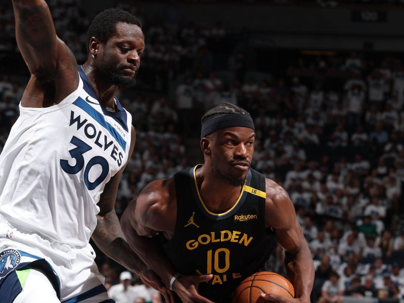MINNEAPOLIS, MN - MAY 6: Jimmy Butler #10 of the Golden State Warriors handles the ball during the game against the Minnesota Timberwolves during Round Two Game One of the 2025 NBA Playoffs on May 6, 2025 at Target Center in Minneapolis, Minnesota. NOTE TO USER: User expressly acknowledges and agrees that, by downloading and or using this Photograph, user is consenting to the terms and conditions of the Getty Images License Agreement. Mandatory Copyright Notice: Copyright 2025 NBAE (Photo by David Sherman/NBAE via Getty Images)