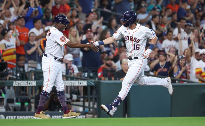 Jul 4, 2023; Houston, Texas, USA; Houston Astros shortstop Grae Kessinger (16) celebrates with third base coach Gary Pettis (8) after hitting a home run during the third inning against the Colorado Rockies at Minute Maid Park. Mandatory Credit: Troy Taormina-USA TODAY Sports