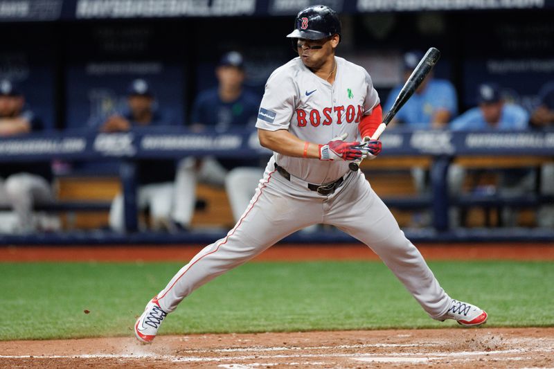 May 22, 2024; St. Petersburg, Florida, USA;  Boston Red Sox third baseman Rafael Devers (11) takes a pitch inside against the Tampa Bay Rays in the fourth inning at Tropicana Field. Mandatory Credit: Nathan Ray Seebeck-USA TODAY Sports