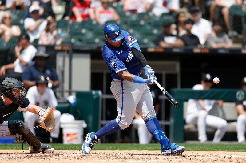 Jun 8, 2025; Chicago, Illinois, USA; Kansas City Royals catcher Salvador Perez (13) hits a two-run home run against the Chicago White Sox during the fourth inning at Rate Field. Mandatory Credit: Kamil Krzaczynski-Imagn Images